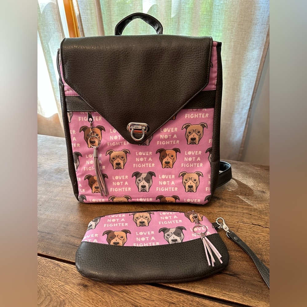 NWOT Backpack Purse w/ Matching Wristlet. Grey Leather/ Purple Printed Fabric.